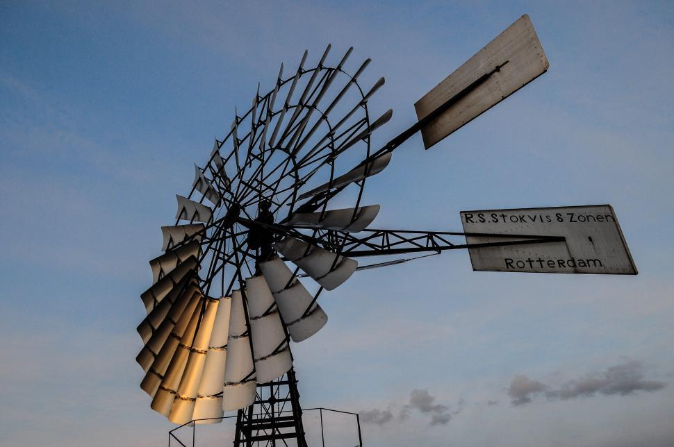 Free Image of Windmill With Two Signs 