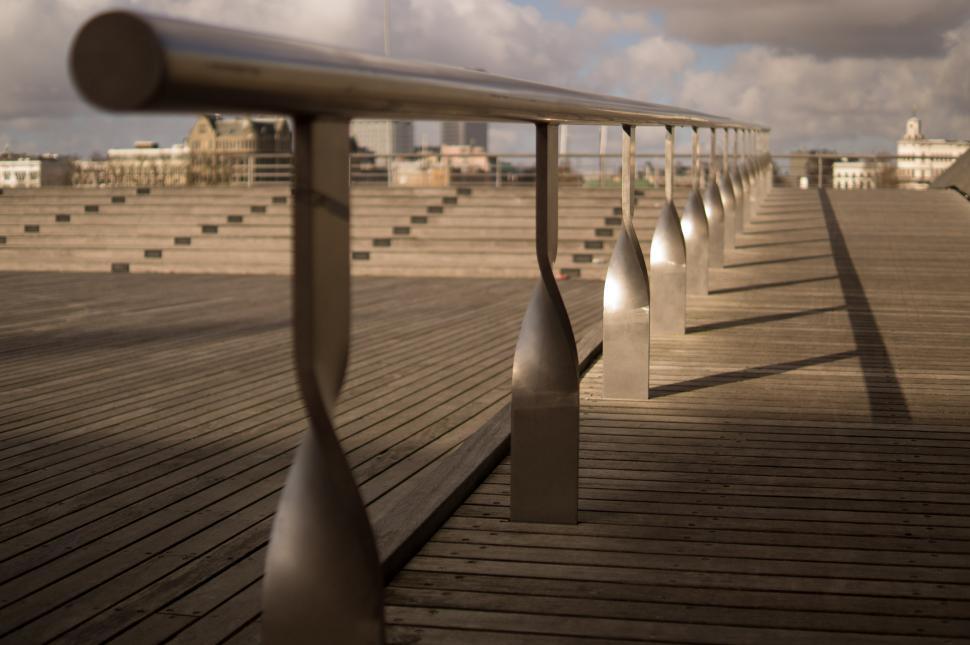 Free Image of Row of Benches on Wooden Pier 