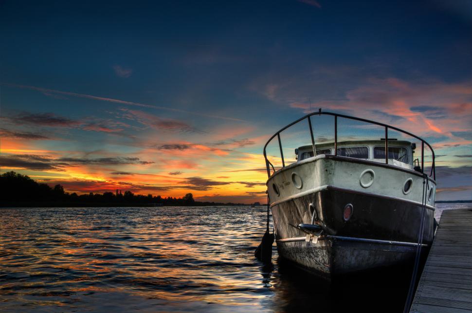 Free Image of Boat Docked at Dock at Sunset 