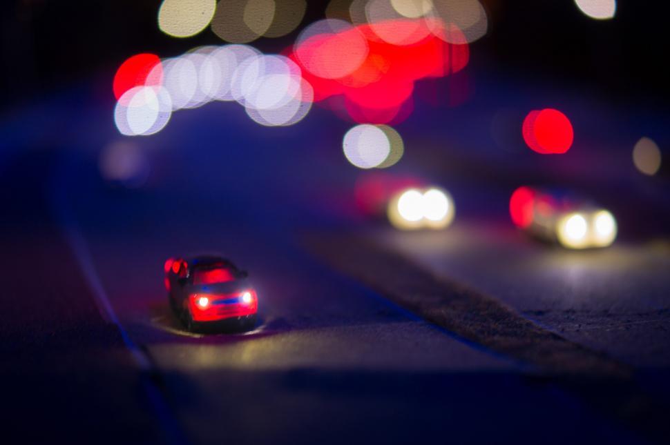 Free Image of Blurry Car Driving at Night 