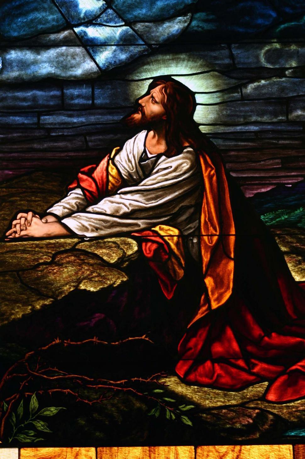 Free Image of Stained Glass of Jesus Sitting on Ground 
