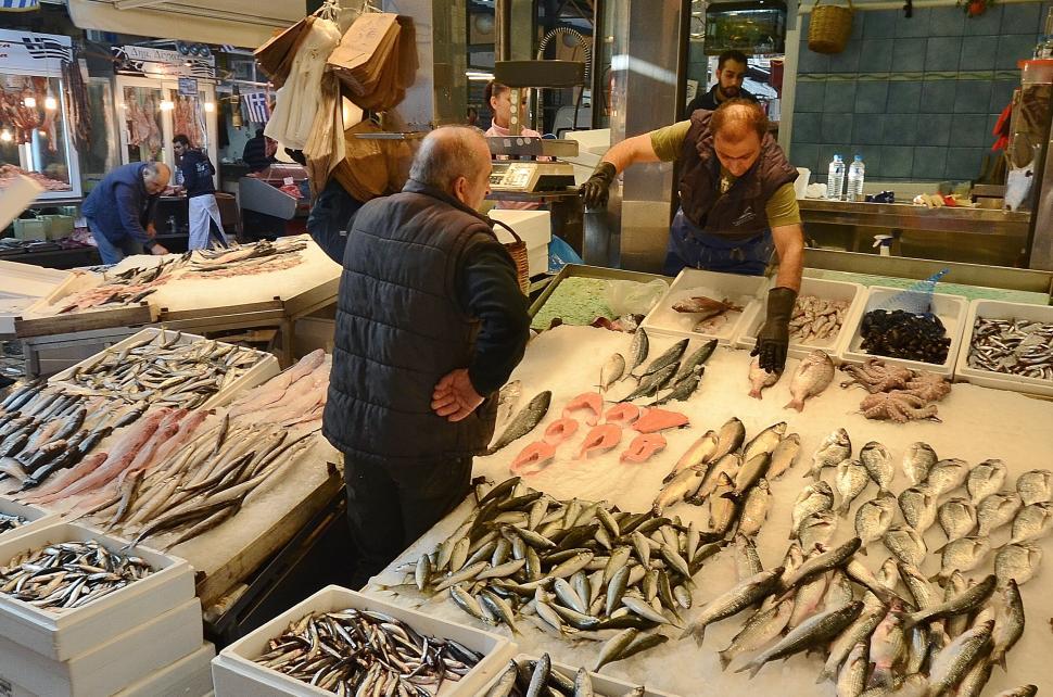 Free Image of People Standing Around Fish Market 