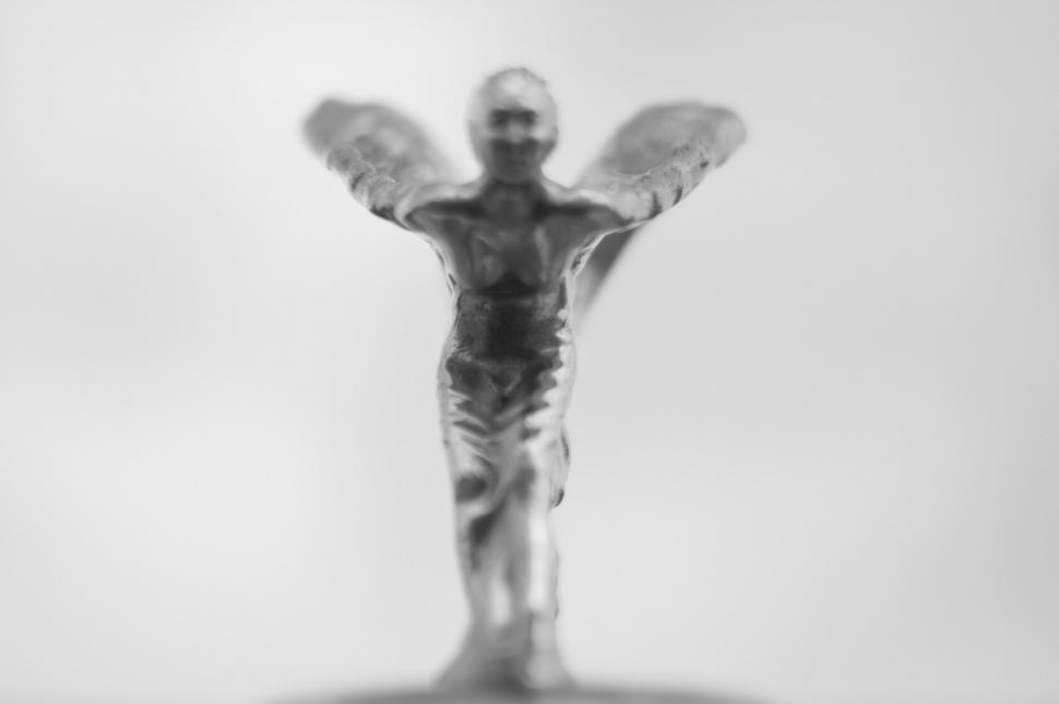 Free Image of Glass Figurine of a Man With Wings 