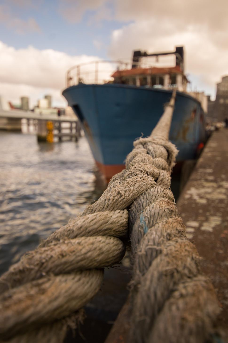 Free Image of Blue and White Boat Docked at Dock 