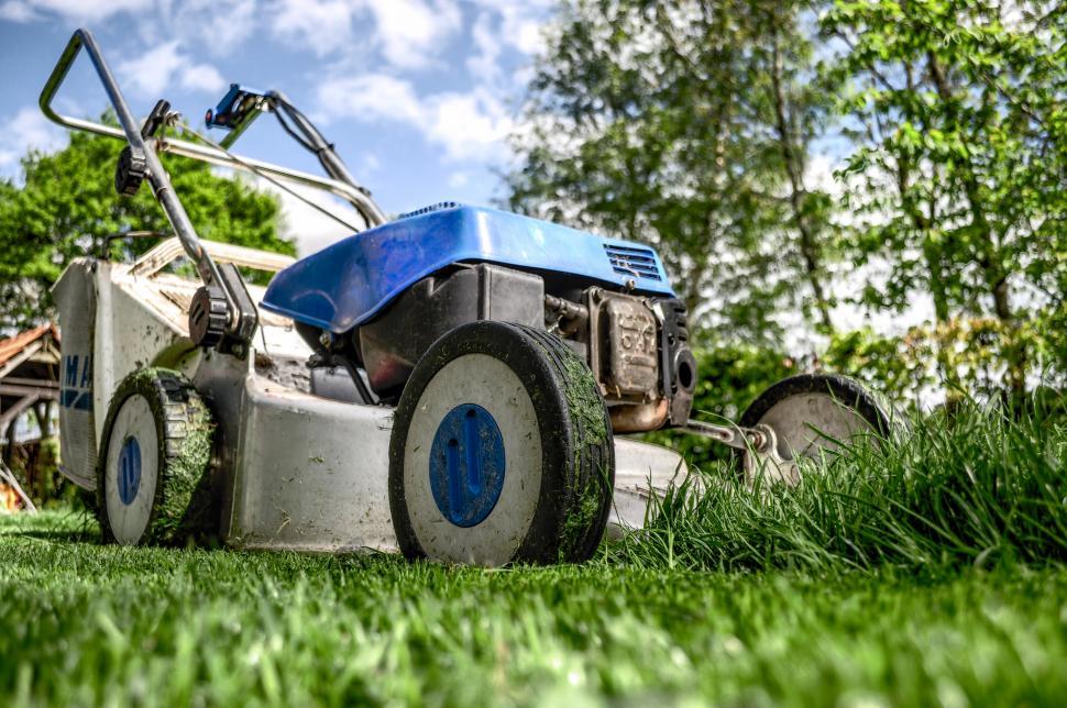 Free Image of Lawn Mower on Lush Green Field 