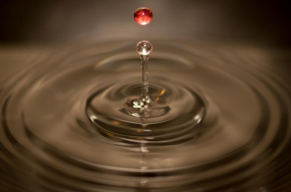 Free Image of Red Diamond Suspended in Water Droplet 