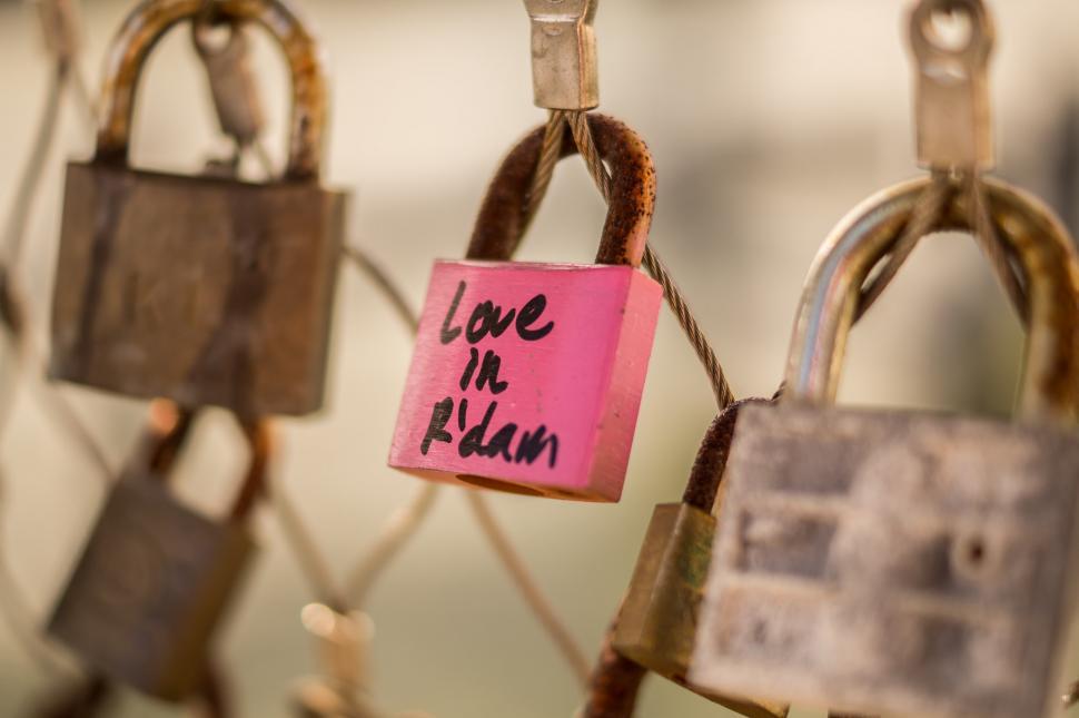 Free Image of Collection of Padlocks With Pink Sign 