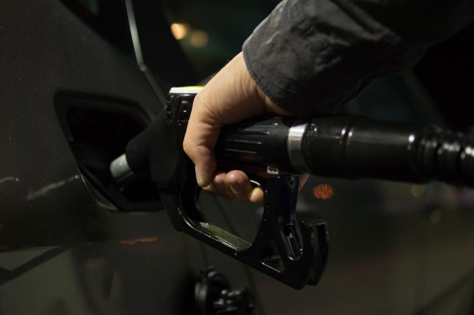 Free Image of Person Pumping Gas Into a Car 
