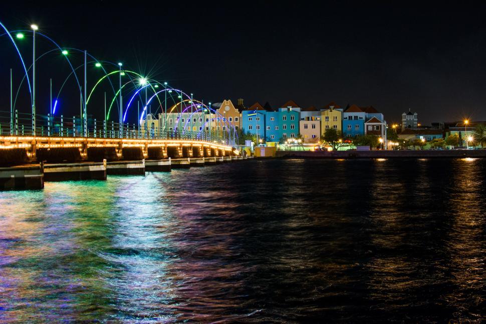 Free Image of Bridge Illuminated Over Water at Night 