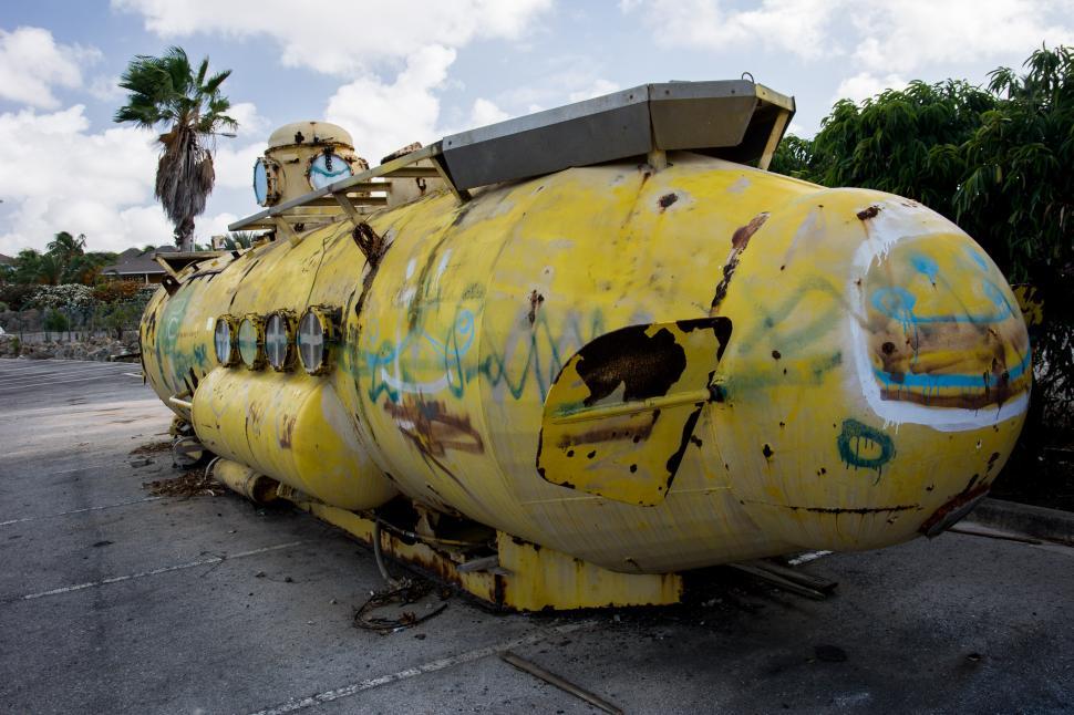 Free Image of Large Yellow Tank Parked on Roadside 