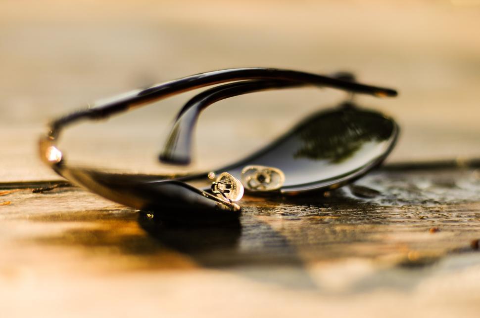 Free Image of Black Glasses on Wooden Table 