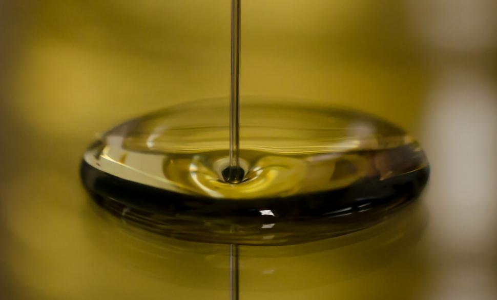 Free Image of Pouring a Drop of Oil Into a Bowl 