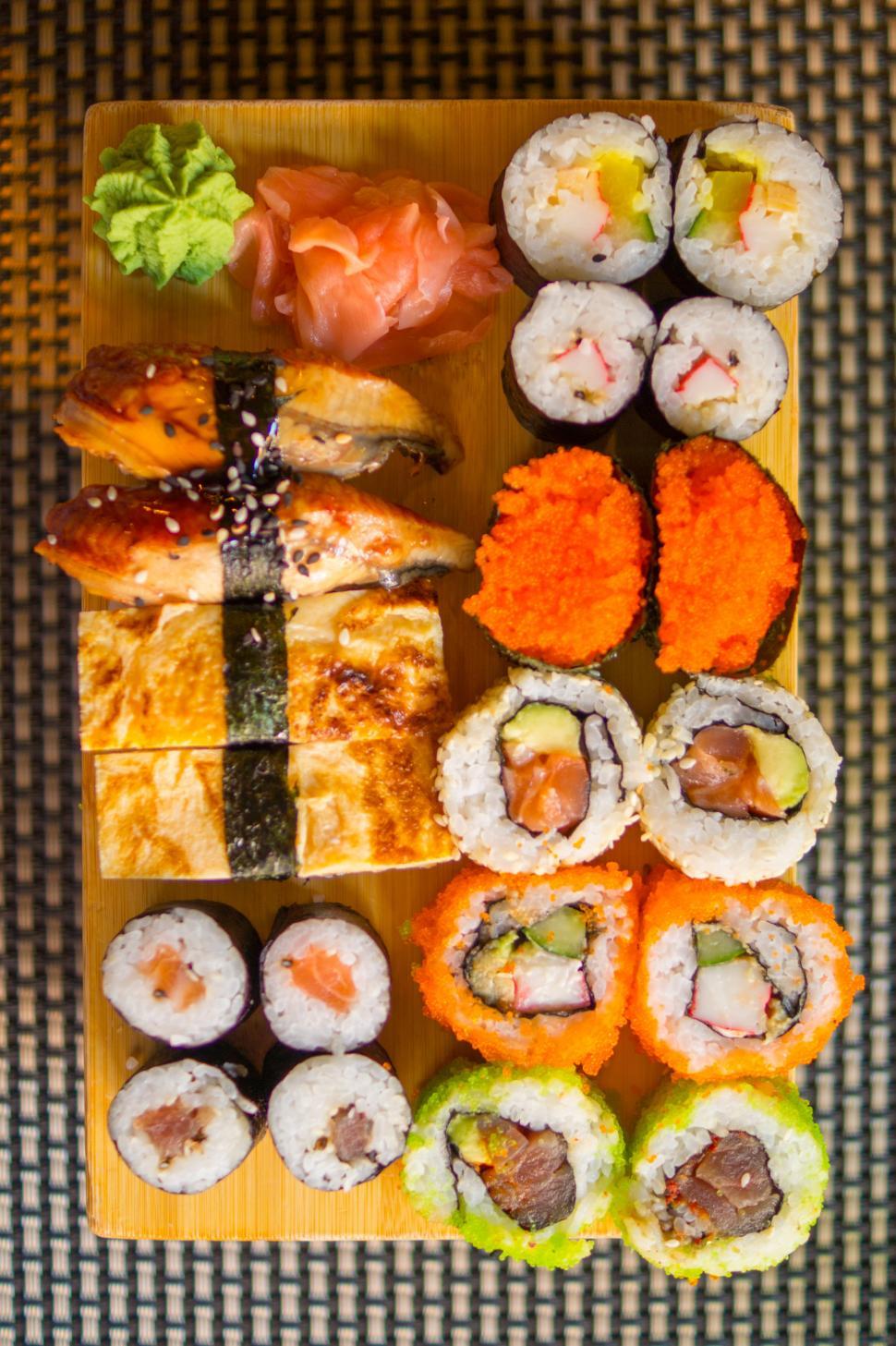 Free Image of Wooden Tray Filled With Sushi Platter 