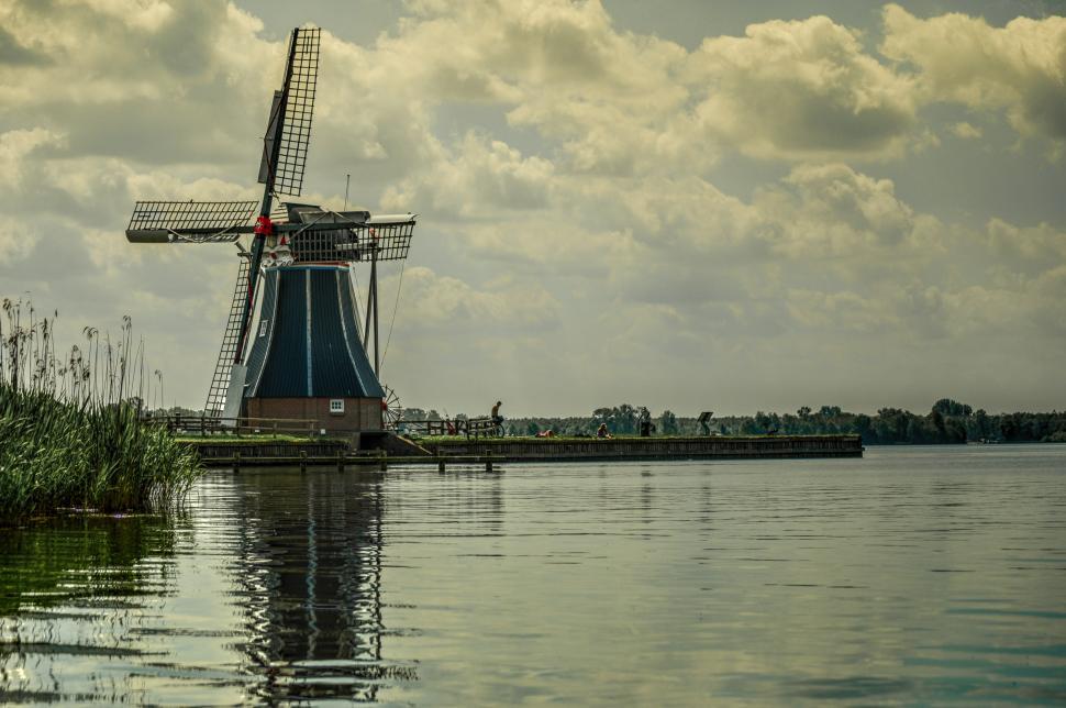 Free Image of Windmill Overlooking Water 