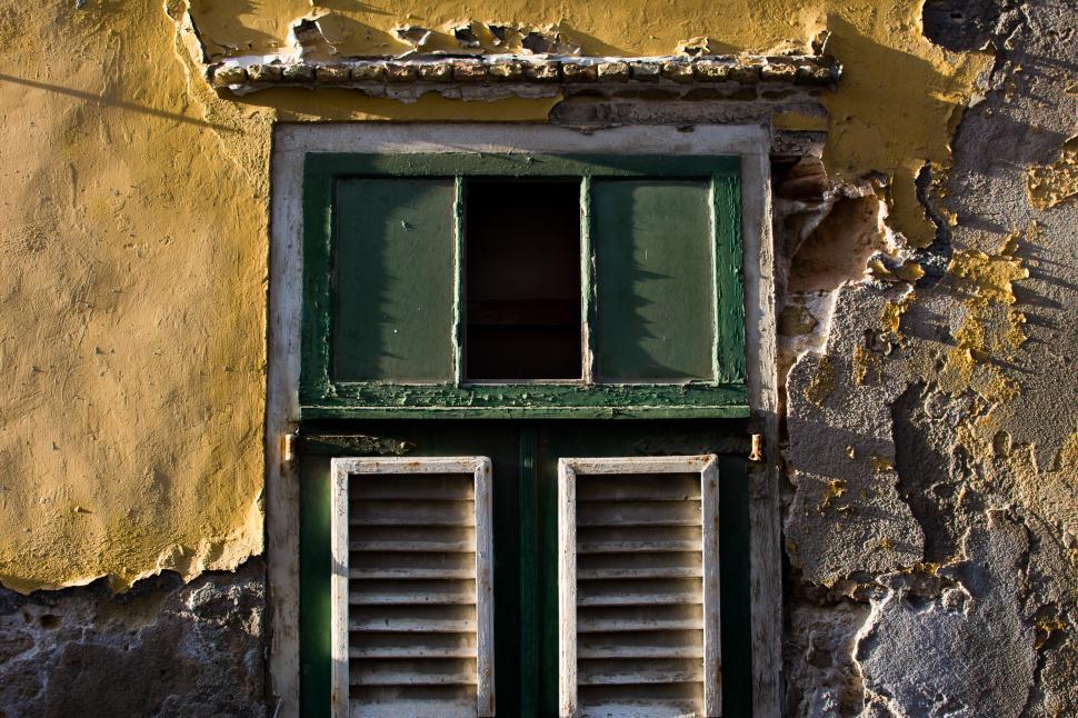 Free Image of Window With Shutters on Side of Building 
