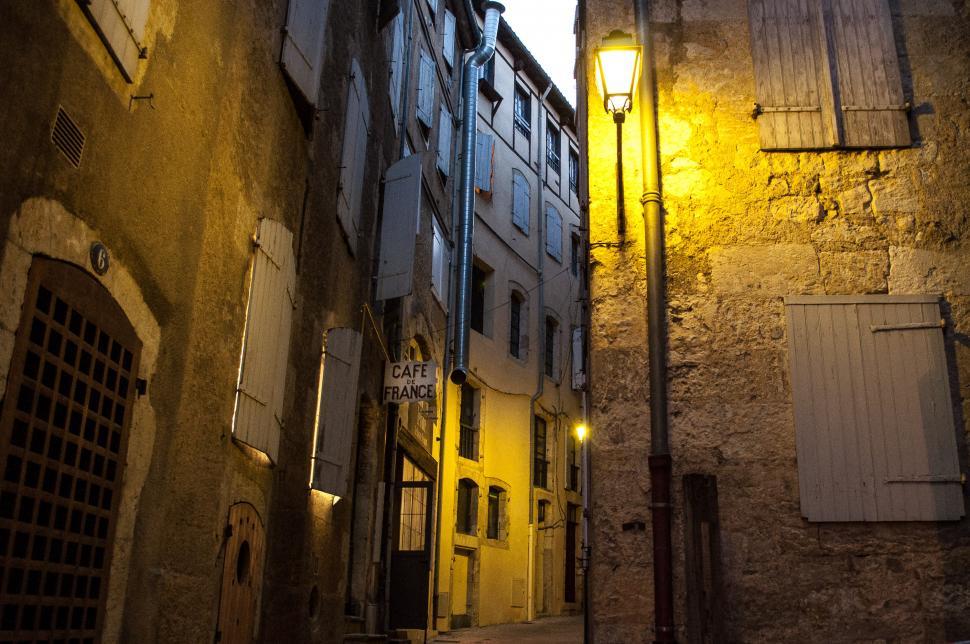 Free Image of Narrow Alleyway With Lamp 