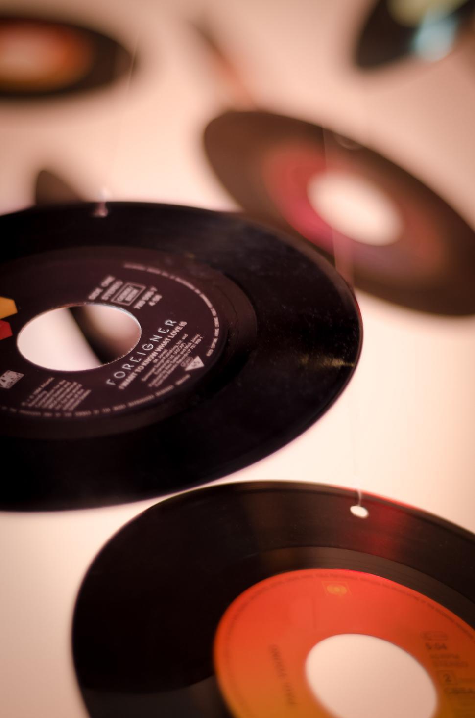 Free Image of Table Topped With Black and Orange Records 