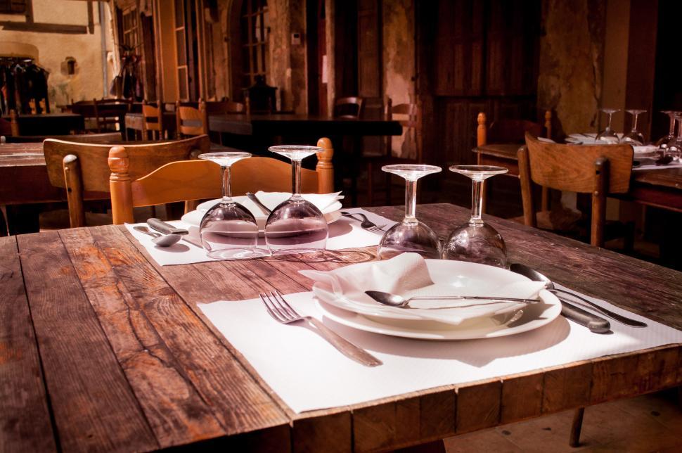 Free Image of Wooden Table With Plates and Silverware 