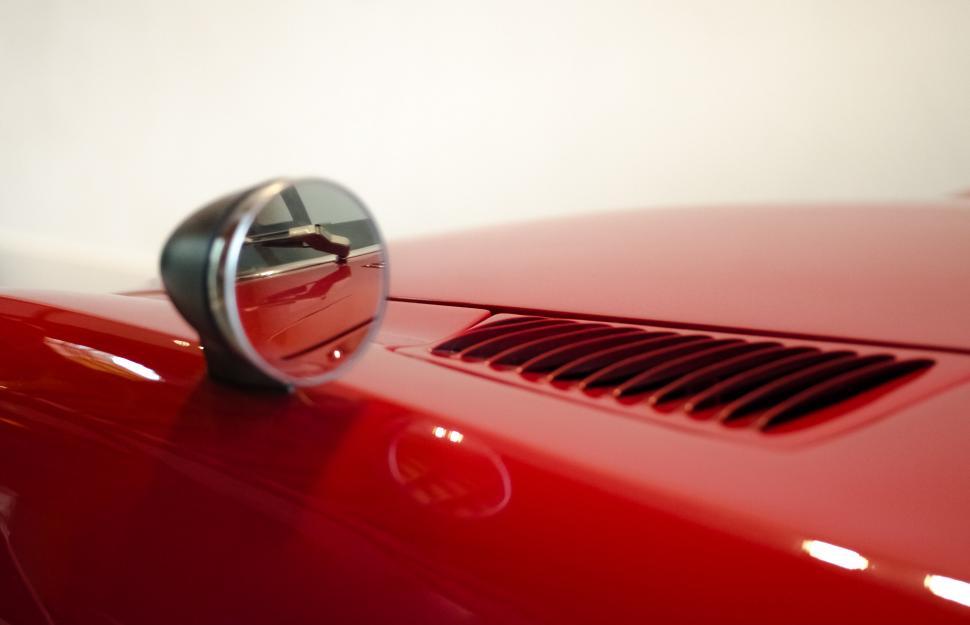 Free Image of Red Sports Car Door Handle Close Up 