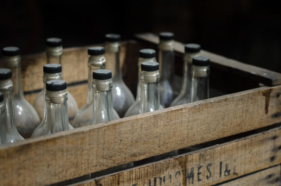 Free Image of Wooden Crate Filled With Empty Bottles 