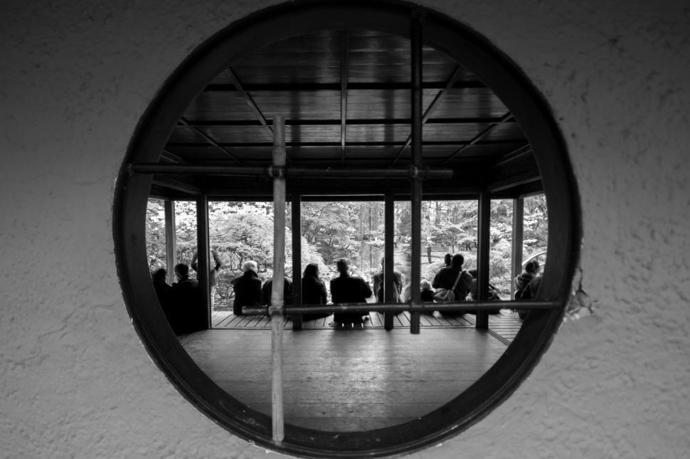 Free Image of Group of People Sitting Around a Table in a Room 