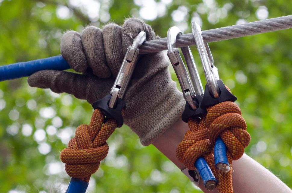 Free Image of Person Holding Rope With Pair of Scissors 