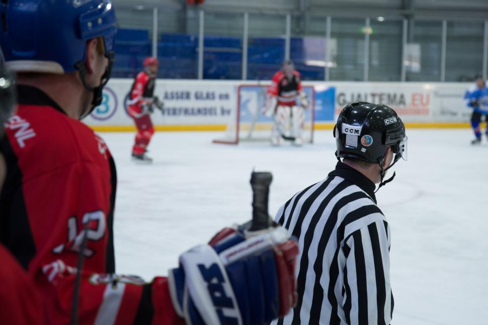Free Image of Referee Having Conversation With Hockey Player on Ice 