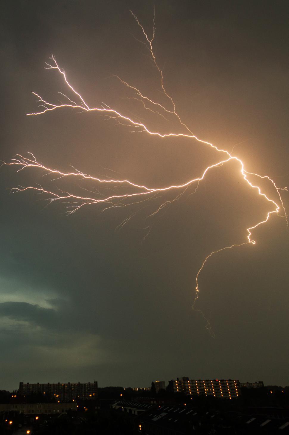 Free Image of Lightning Bolt Illuminates Sky Above City 