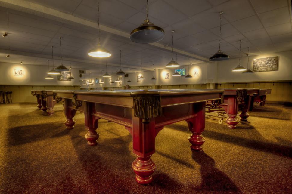 Free Image of Spacious Room With Large Pool Table and Lights 