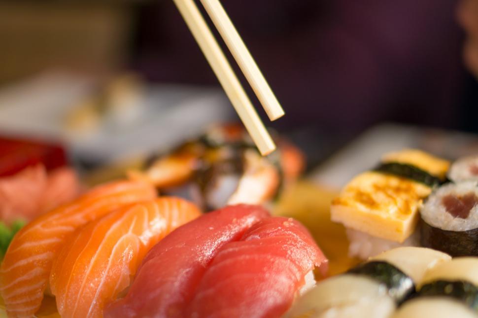 Free Image of Plate of Sushi With Chopsticks 