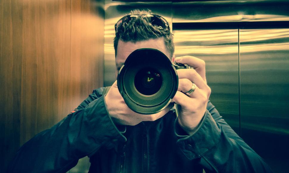 Free Image of Man Taking a Picture of Himself in a Mirror 