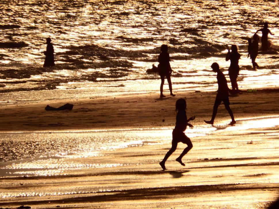 Free Image of Family Plays on the Beach Silhouette  