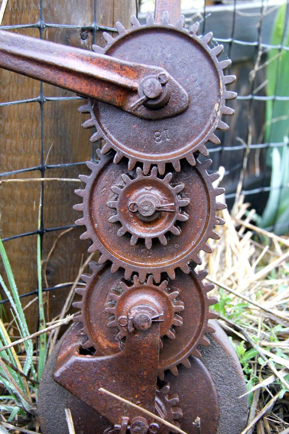 Free Image of gears rusted antique interconnected interlocking sprockets teeth iron weathered wheels pins cotter 