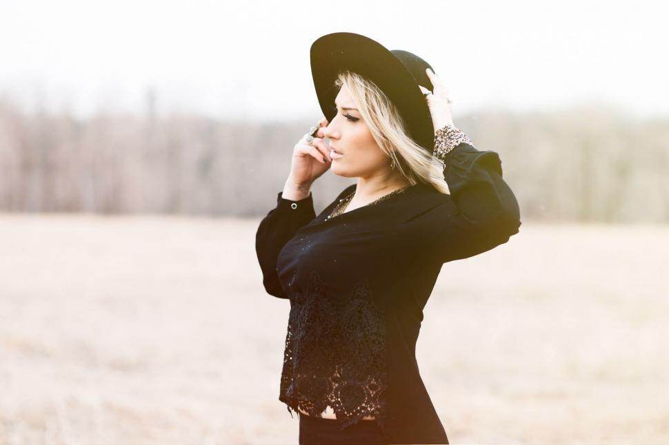 Free Image of Woman in Black Hat and Shirt 