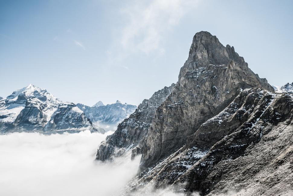 Free Image of Towering Mountain With Clouds 