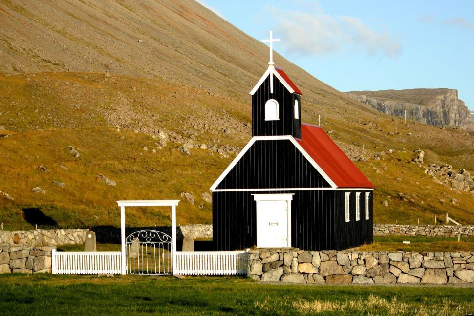 Free Image of Small Black Church With Red Roof 