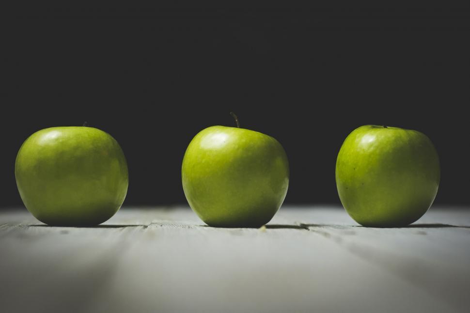Free Image of Three Green Apples Aligned in a Row 