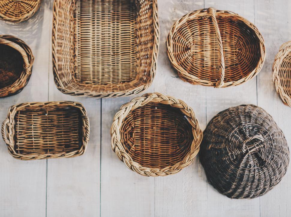 Free Image of Wicker Baskets Arranged on White Wooden Floor 
