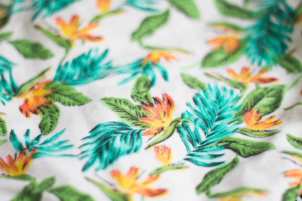 Free Image of Close Up of Flowered Fabric With Green Leaves 