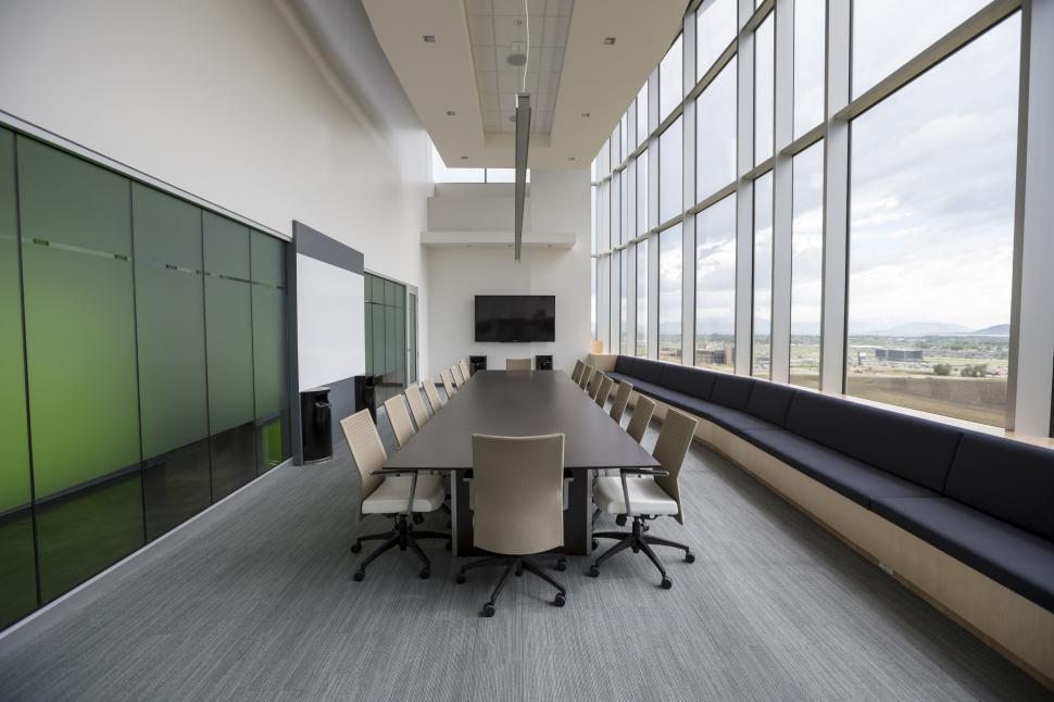 Free Image of Modern Conference Room With Large Table and Chairs 