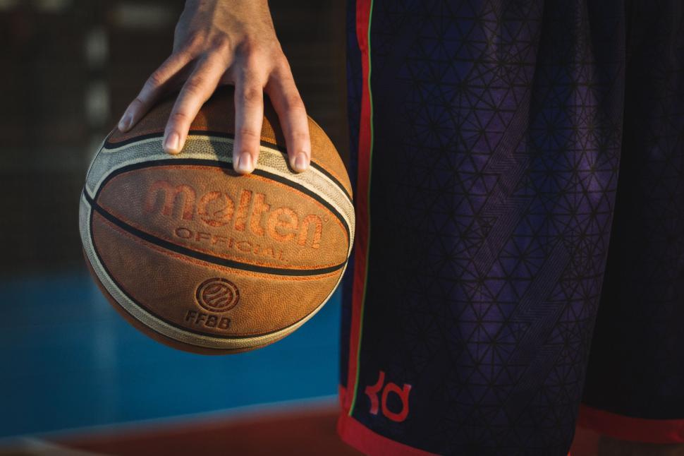 Free Image of Person Holding Basketball Close Up 