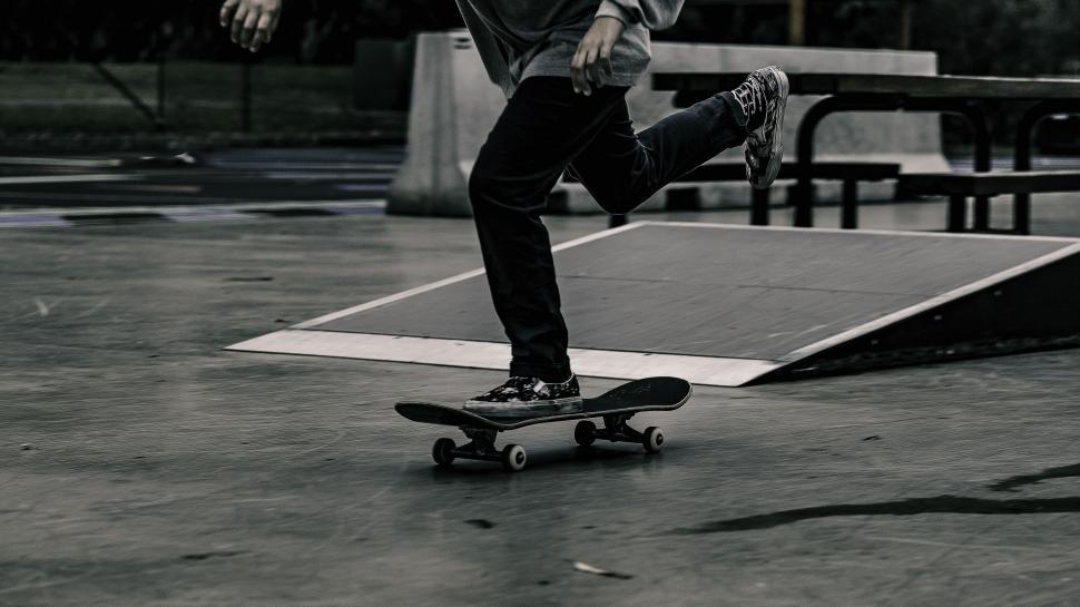 Free Image of Man Skateboarding on Cement Floor 