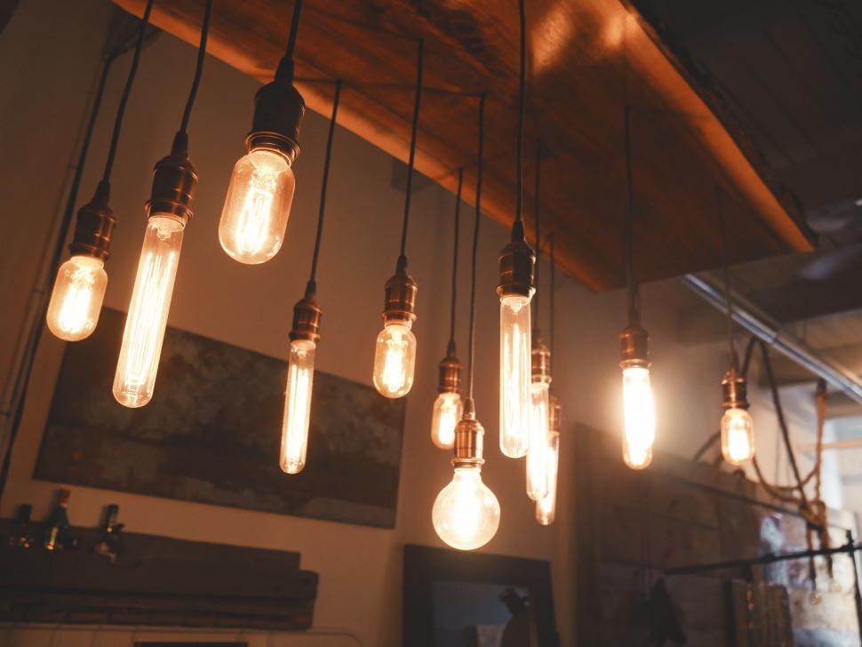 Free Image of Array of Light Bulbs Hanging From Ceiling 