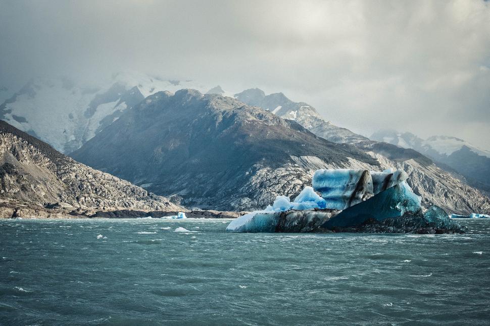 Free Image of Massive Iceberg Floating on Body of Water 