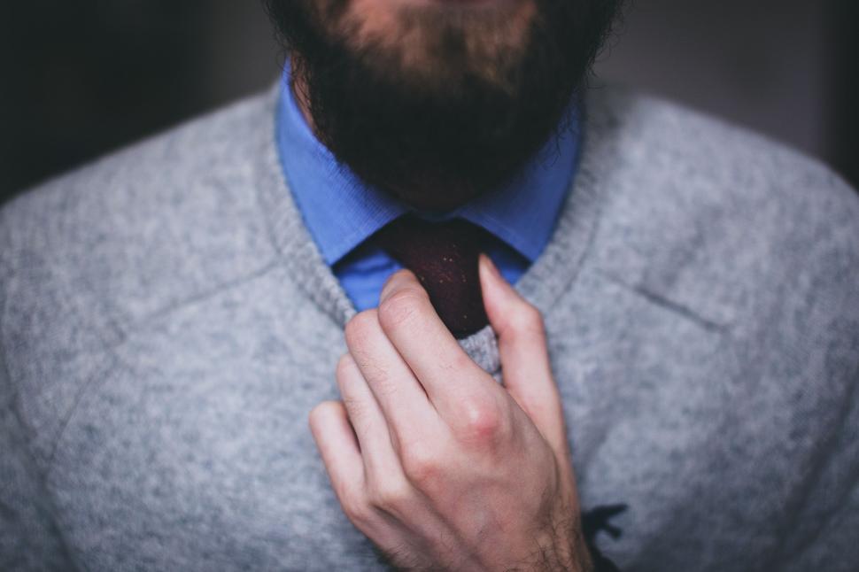 Free Image of Man Wearing Sweater and Tie 