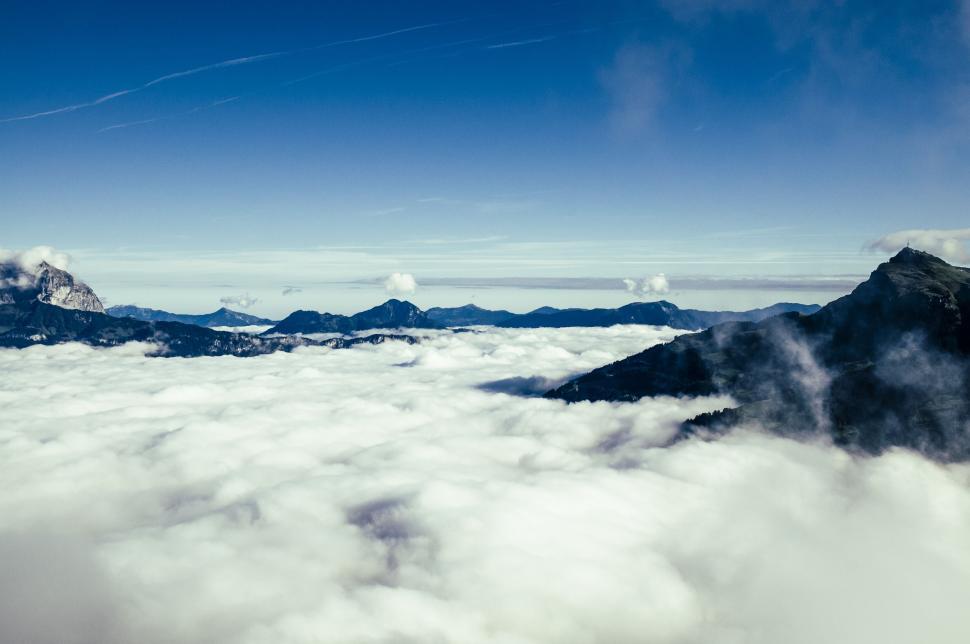 Free Image of A View of Mountains and Clouds From a Plane 
