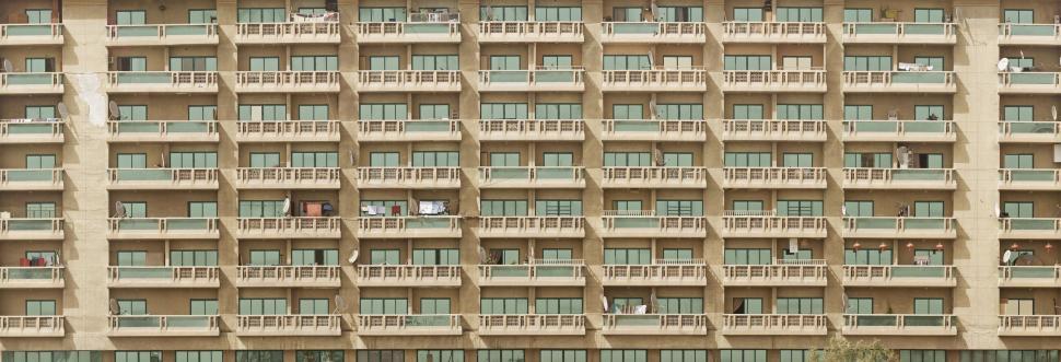 Free Image of Tall Building With Balconies and Side Balconies 