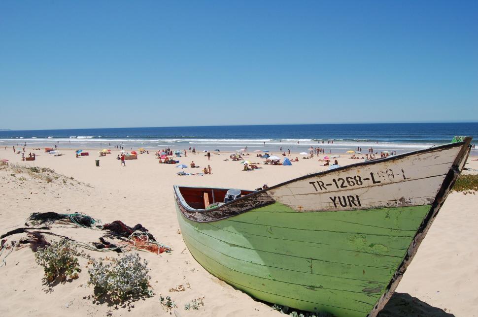 Free Image of Green Boat on Sandy Beach 