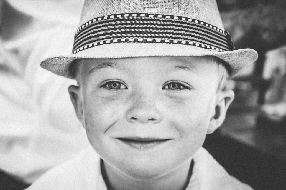 Free Image of Young Boy Wearing Hat in Black and White 