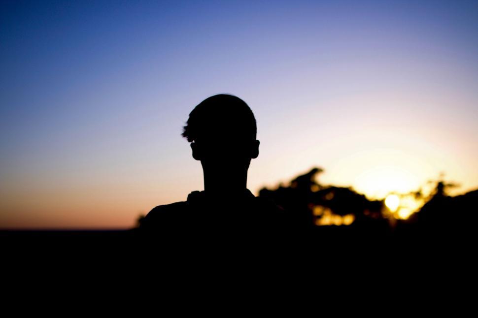 Free Image of Silhouette of Person in Front of Sunset 